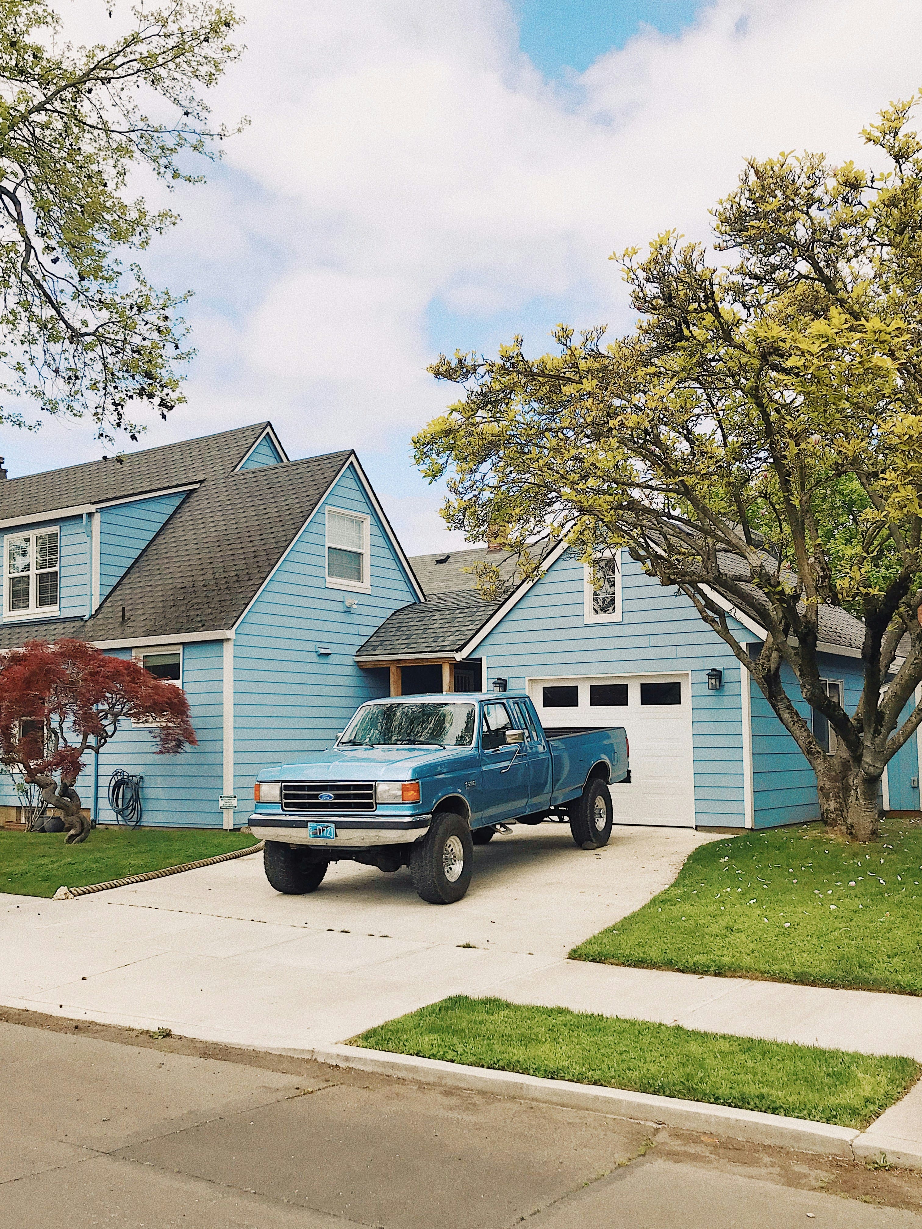 Blue truck parked in driveway